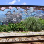 Laurel & Hardy Florist Mural - Harlem, GA Oliver Hardy was from Harlem, GA and is commemorated all around town, In this view, the mural faces the train tracks in town.  The mural is also landscaped since this building belongs to a florist.  This can be found where highway US221 crosses the tracks in the middle of town.