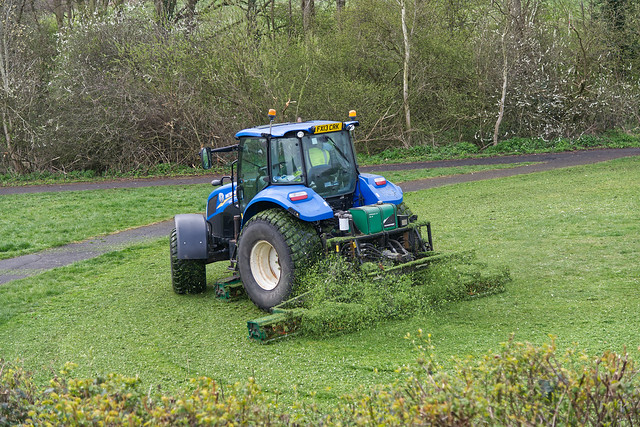 Tractor mowing grass