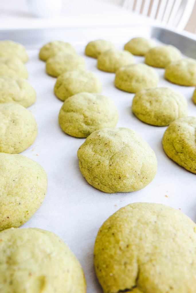 Cookies right out of the oven on a baking sheet. 