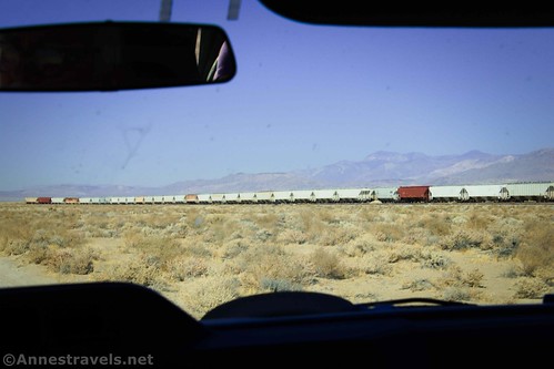 The train on the railroad track along the road into the Trona Pinnacles National Natural Landmark, California