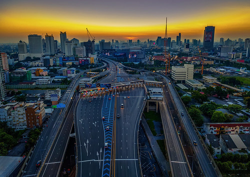 bangkok sunrise morning expressway motorway toll tollbooth east road roads cityscape city golden glow