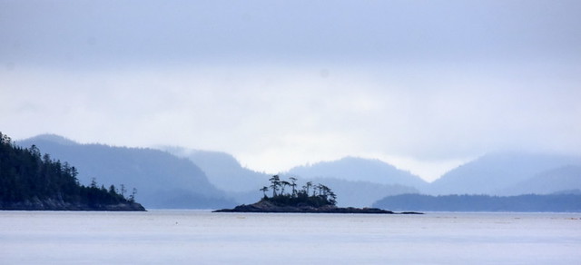 ISLAND AND MOUNTAINS IN  LAYERS OF BLUE.       JOHNSTONE STRAIT,  BC.