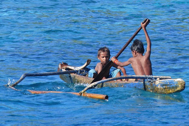 Kids rowing in a perahu, Pulau Pura, Alor NTT