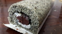 Black Sesame Swiss Roll with red bean filling.. got it from a local bakery shop..