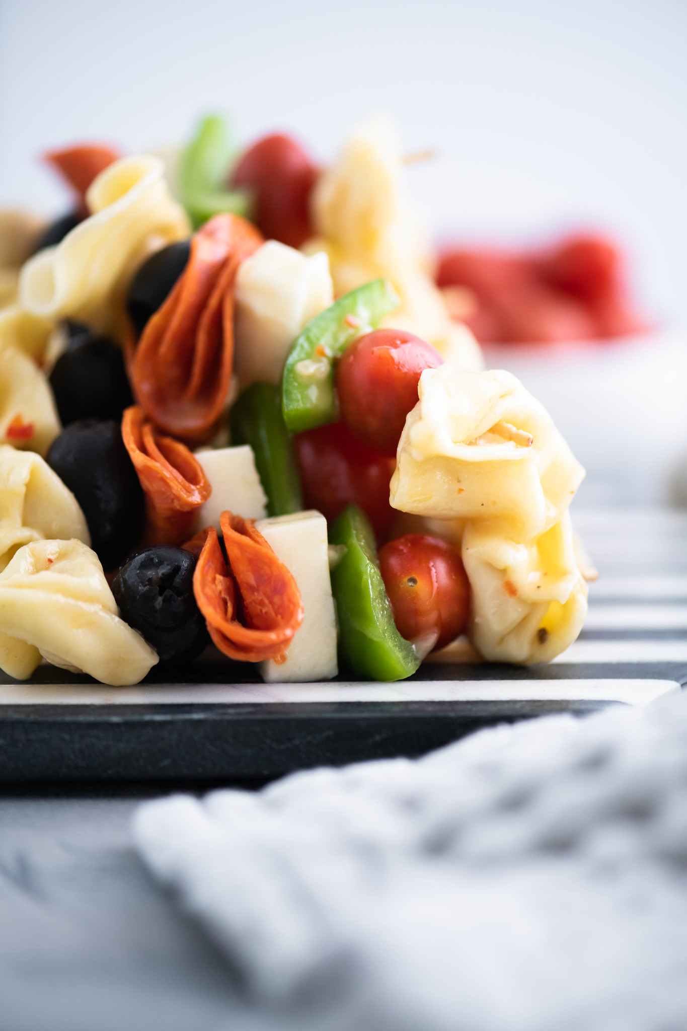 Looking for a fun appetizer or creative lunch box addition? Pasta Salad on a Stick takes all the classic pasta salad ingredients and threads them on a long toothpick for a delicious new spin. Perfect for parties and afternoon snacks alike.