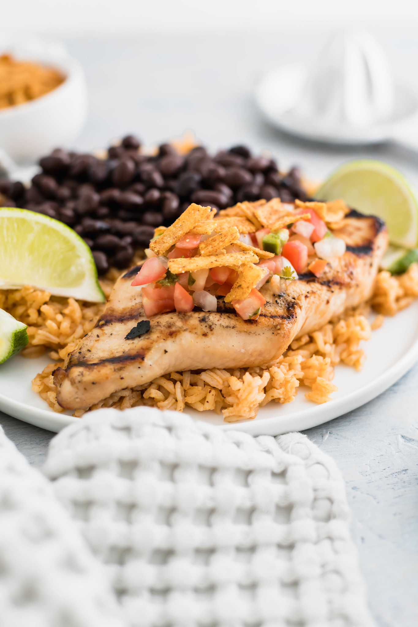 Chili's margarita chicken on a bed of Mexican rice with beans on the side.