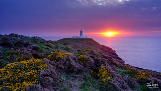 Sunset over Strumble Head light house, Wales, UK