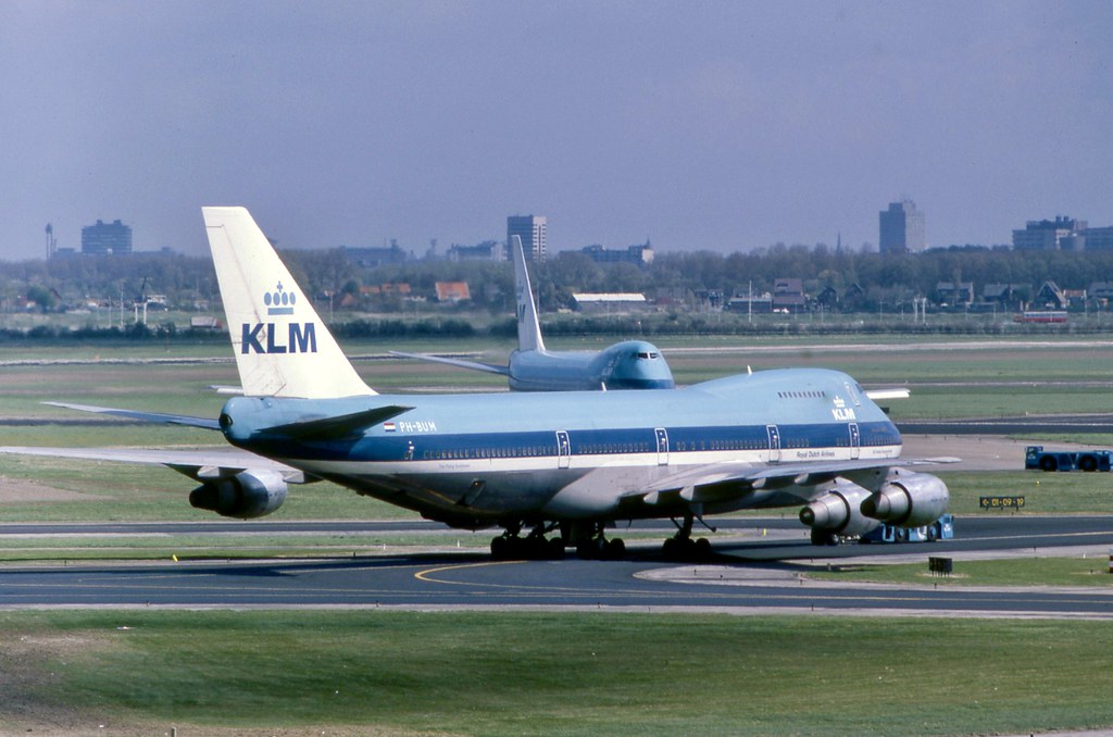 Mighty Leviathans :) KLM Boeing 747-206SCD PH-BUM seen under tow at Amsterdam Schiphol whilst another of the fleet taxies in