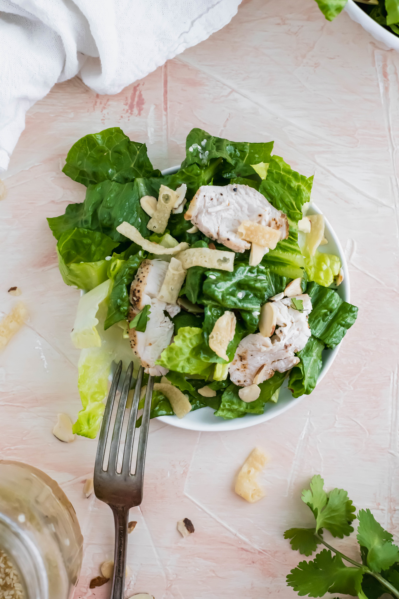 Make your favorite salad at home with this recipe for Panera's Asian Sesame Chicken Salad. It tastes JUST like the restaurant version at a fraction of the cost.