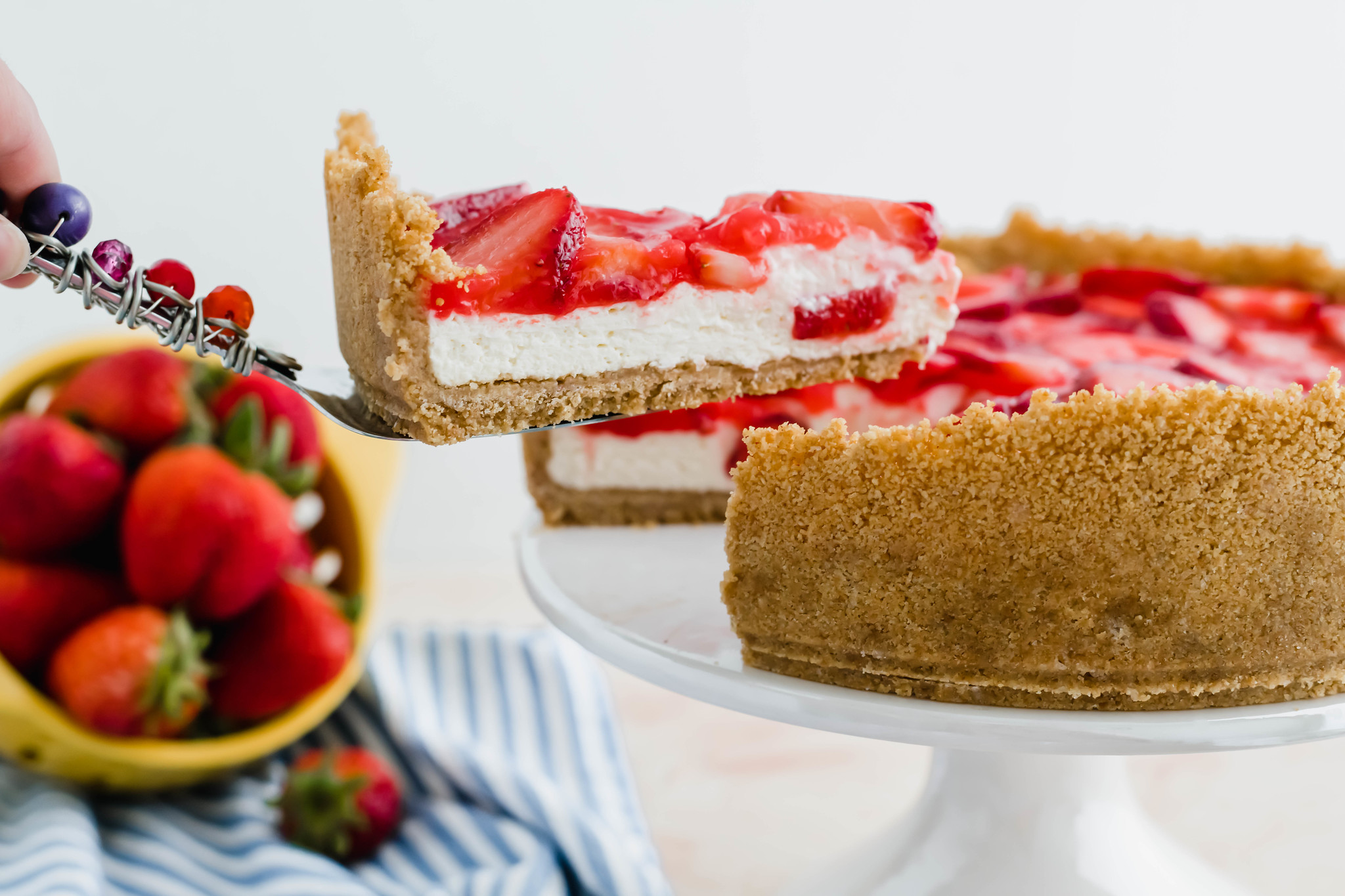 I combined two favorite summer desserts, cheesecake and strawberry pie, to make the most delicious treat, Strawberry Cream Cheese Pie. A fluffy, no-bake cheesecake filling topped with classic strawberry pie filling will have you addicted in no time.