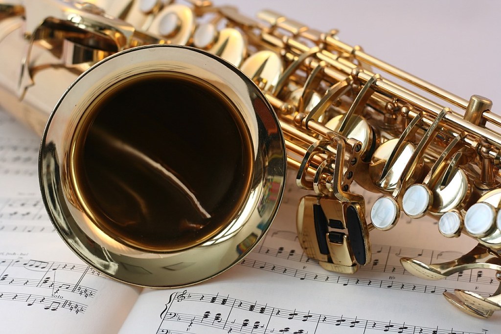 saxophone resting on music score - how to practice music