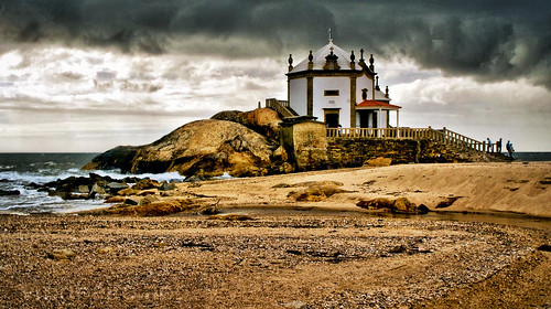 portugal ocean chapel oporto exterior blue porto portuguese water outside religion structure waves christian sand christianity rock seascape atlantic da edifice famous old sunset dusk horizontal lord panoramic photography place silhouette sunrise twilight dawn religious worship clouds daylight light seaside shoreline staircase urban architectural europa hexagonal historic historical monument