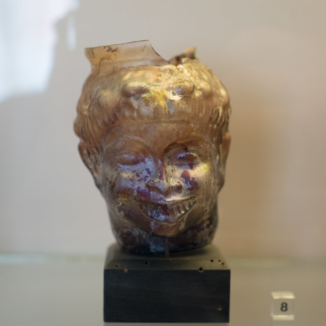 Roman glass vessel representing the head of a youth, from Pompeii 1