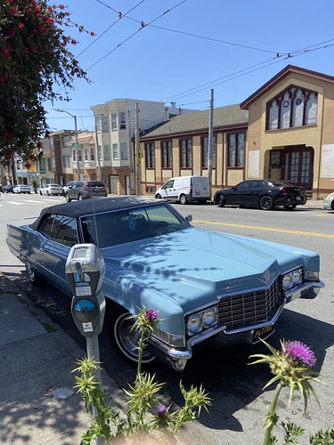 Beautiful and well-conditioned 1970ish clothtop Cadillac Coupe de Ville, parked across a Julia Morgan designed church, Excelsior, San Francisco. It is just hard to imagine a two door car could ever be so long, but it is. #coupedeville #vintagecadillac #ex | by bageltam