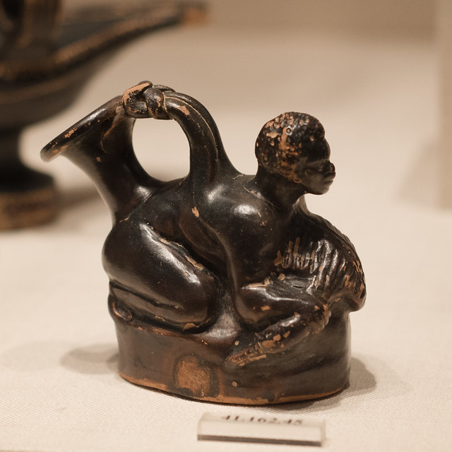 Campanian Black Gloss askos in the form of a Black African boy with a duck