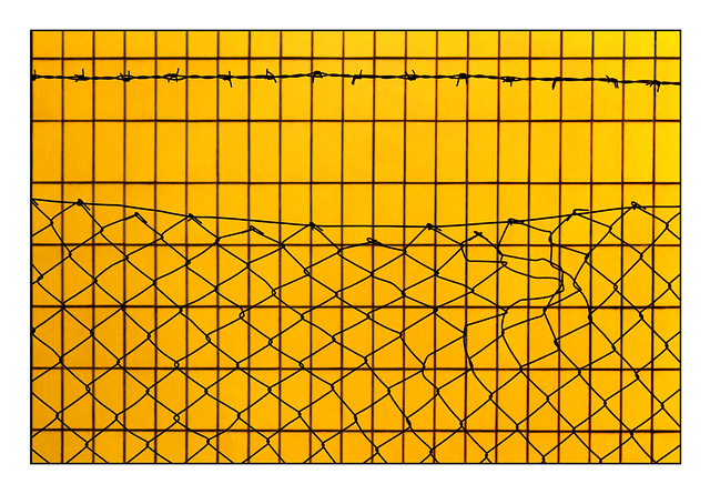 fenced stripes on yellow wall