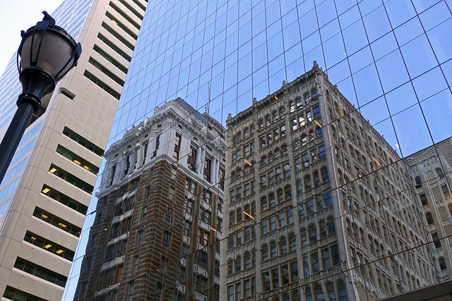 Reflection of the Wesley Building aka Robert Morris Hotel at Comcast Center in Philadelphia, PA