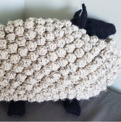 Kay (@kayrobbins) knit Purl SoHo’s Bobble Sheep Pilloe to ship to her new grand baby!!