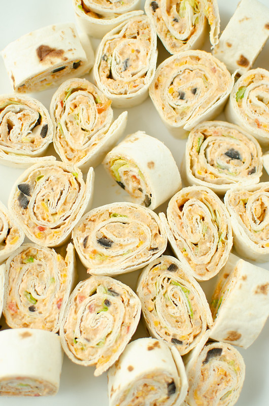Taco Pinwheels - taco meat, salsa, cheddar cheese, and all the taco fixins rolled into flour tortillas and sliced into bite-size pinwheels! Easy, delicious, kid-friendly lunch! These are great for summer break. 
