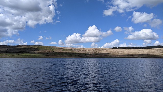 View across Withens Clough Reservoir to Stoodley Pike.