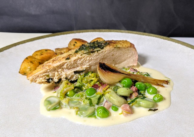 Free-range cornfed Cornish Red chicken breast, slow-cooked on the crown with chervil butter. Served with its own sauce, smoked bacon, peas, broad beans, lettuce, chervil dumplings.
