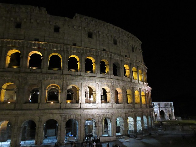 Colosseum at night, view to Arch of Constantine, Rome, Italy