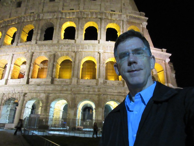Paul visits Colosseum at night, Rome, Italy