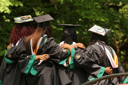 Graduates pose for a photograph during the traditional Walk Across Campus.