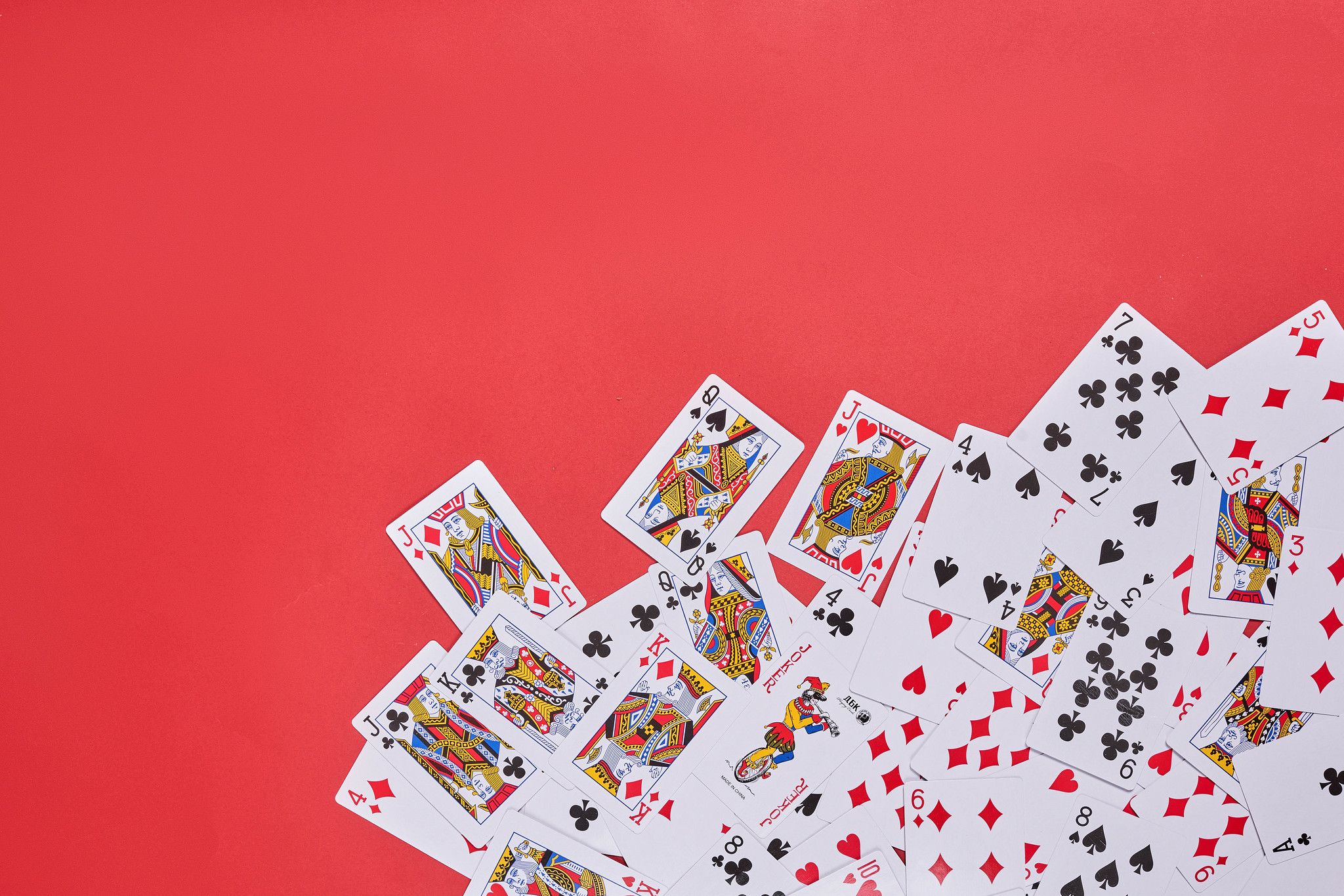 Playing cards on red backdrop