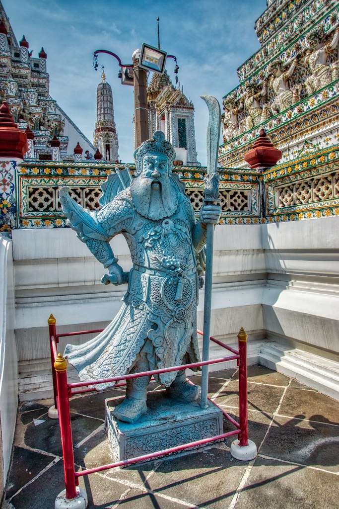 Guardian Statue at Wat Arun, the Temple of Dawn, by the Chao Phraya river in Bangkok, Thailand