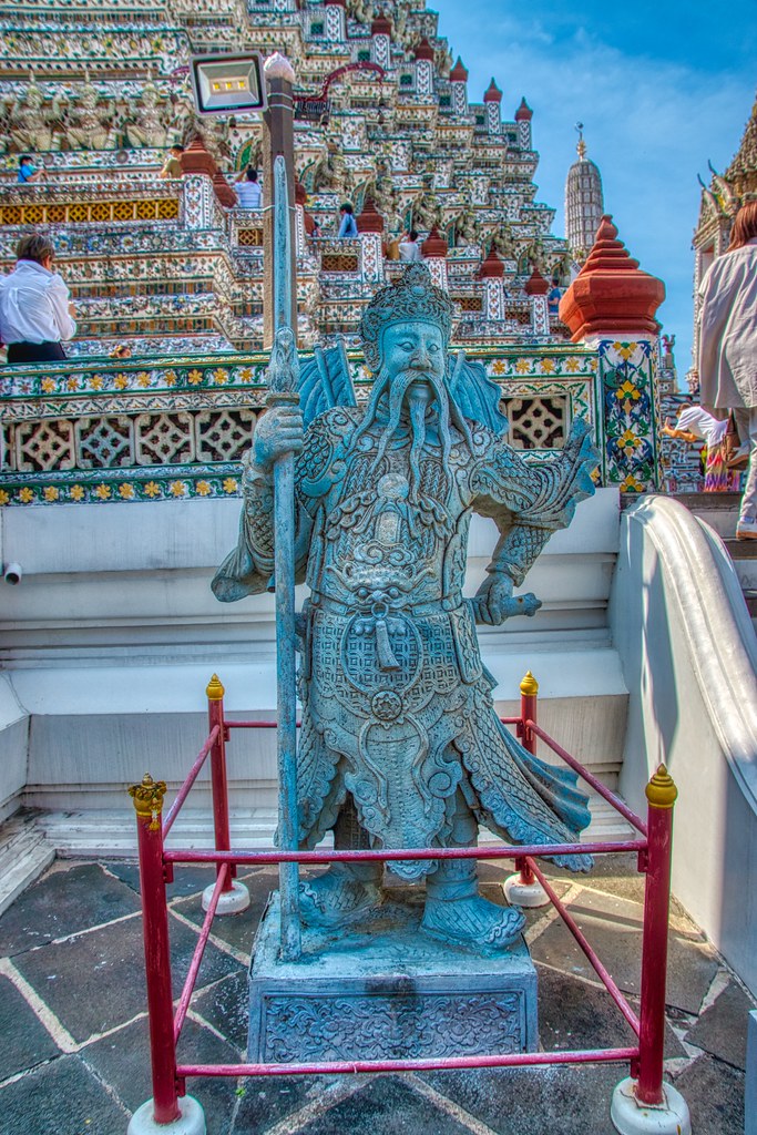 Guardian statue at Wat Arun, the Temple of Dawn, by the Chao Phraya river in Bangkok, Thailand