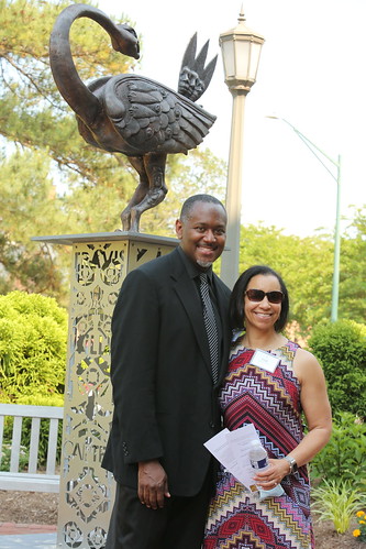 Legacy Tribute Garden: Steve Prince, director of engagement and distinguished artist in residence at the Muscarelle Museum of Art, and Leah Glenn, professor of dance and director of W&M dance program, pose in front of the Sankofa Seed sculpture.