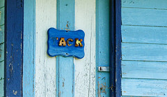 Blue door of old shed used for tack storage