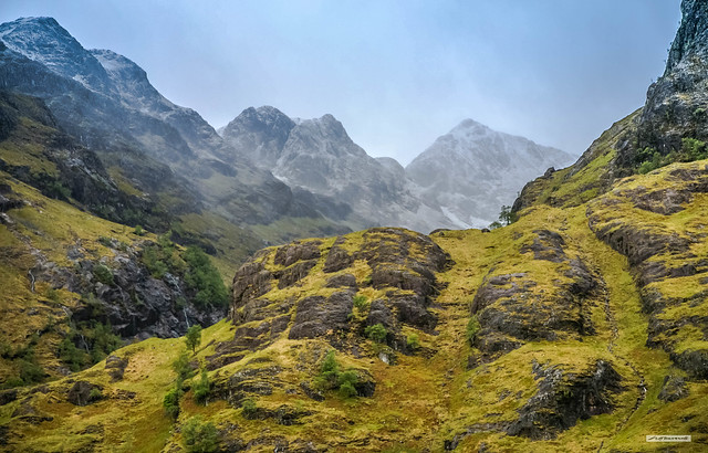 The awesome grandeur of Glencoe looking southwards, with a dusting of snow on the high peaks, even in May, Argyll, Scotland