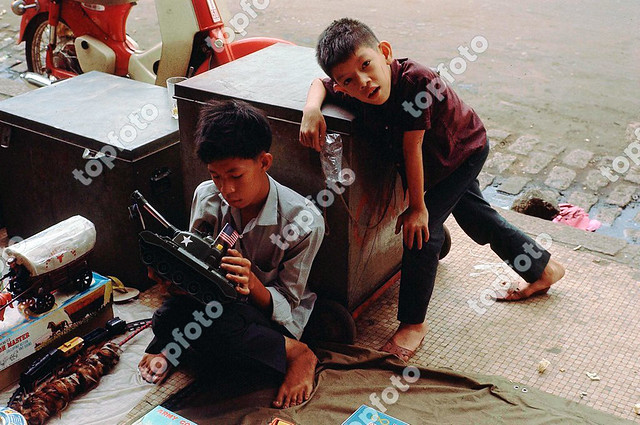 Children selling American toys in Vietnam