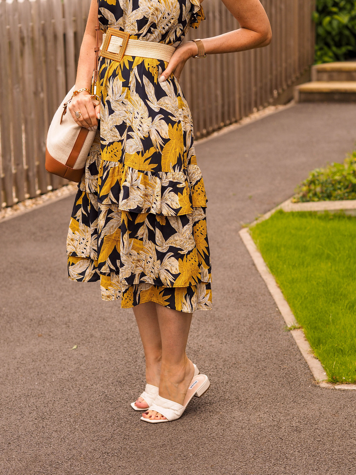 The Power of Accessories: Styling a Tiered Summer Dress (yellow/black/white dress with raffia belt, white slider sandals, brown/ecru shoulder bag, yellow lens glasses & a straw trilby) | Not Dressed As Lamb