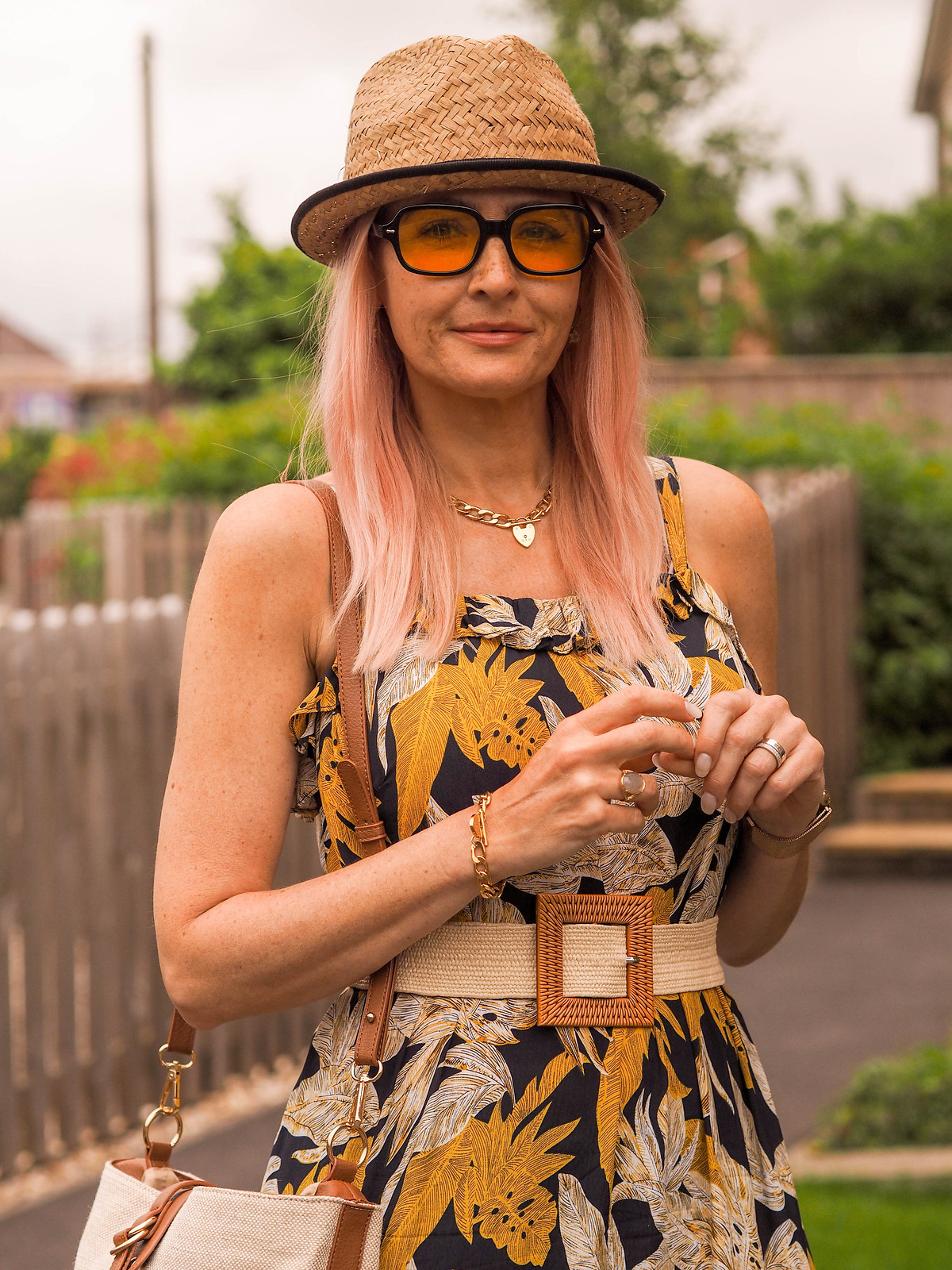 The Power of Accessories: Styling a Tiered Summer Dress (yellow/black/white dress with raffia belt, white slider sandals, brown/ecru shoulder bag, yellow lens glasses & a straw trilby) | Not Dressed As Lamb