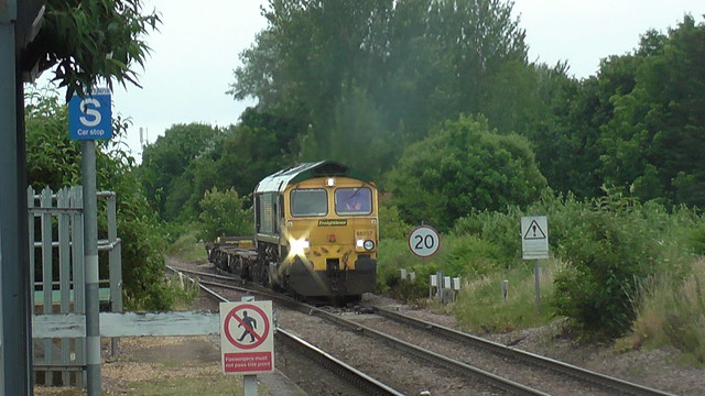 66 557 approaches Trimley Station hauling an intermodal train.