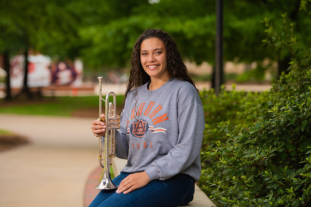 Brianna Jarvis with her trumpet on campus at Auburn.