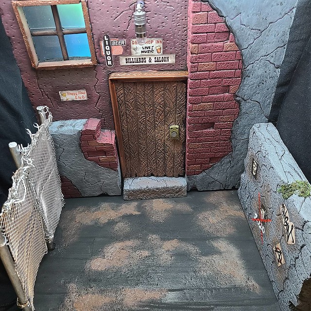 Did this seedy bar 1:12 scale for a customer all hand made with custom sculpt work and l.e.d. lighting.