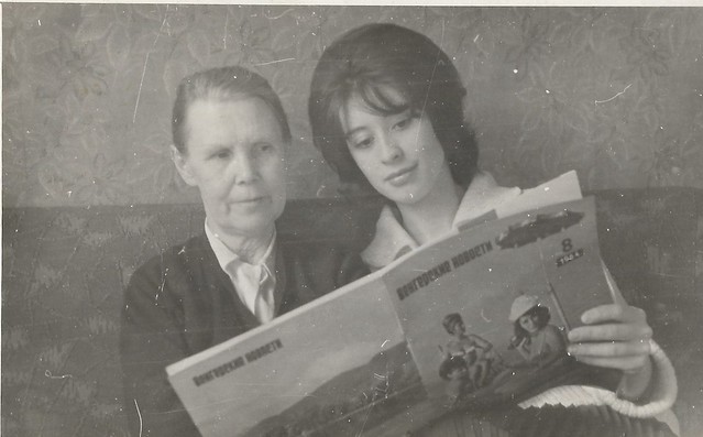 Mother and daughter read a magazine