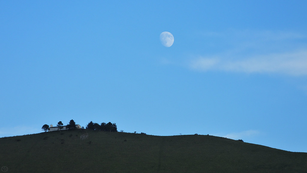 moon over house on hill