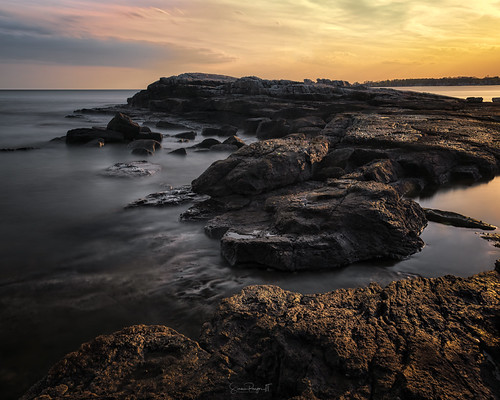 Kissed by Simmie | Reagor - https://www.simmulated.com/blog, Hard, jagged, weathered and beaten by the sea. The mighty formation seems much softer when kissed b