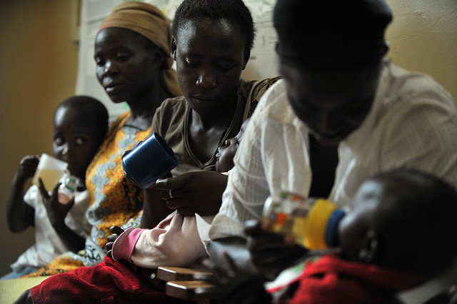 Mother administering ORS - Kenya