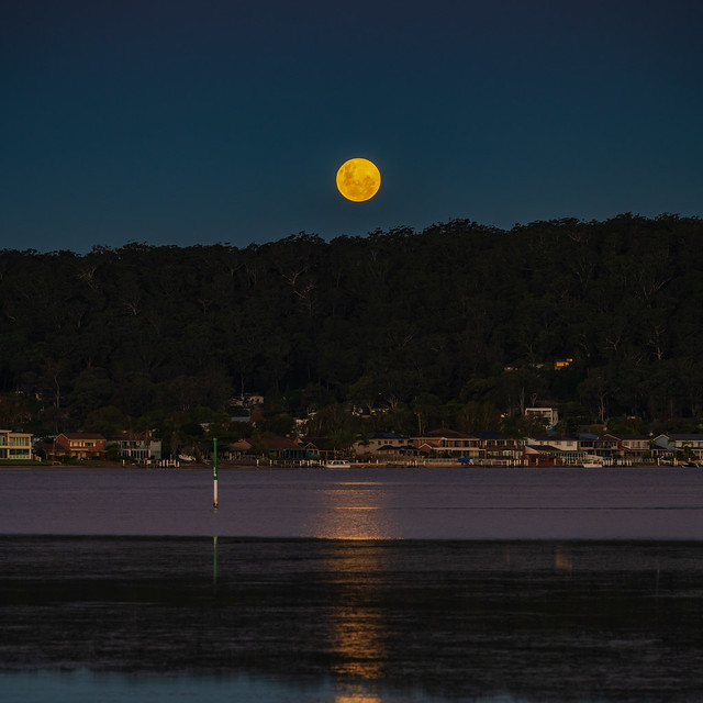 Full moon rising at the waterfront