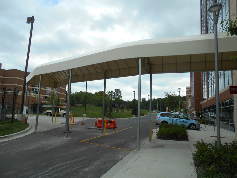 lift-capabilities-constructing-long-contoured-entrance-canopyby-a-hoffman-awning