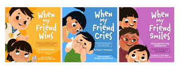 The image shows yellow book cover at the left, light blue in the middle and violet in the right side with the children's designs.