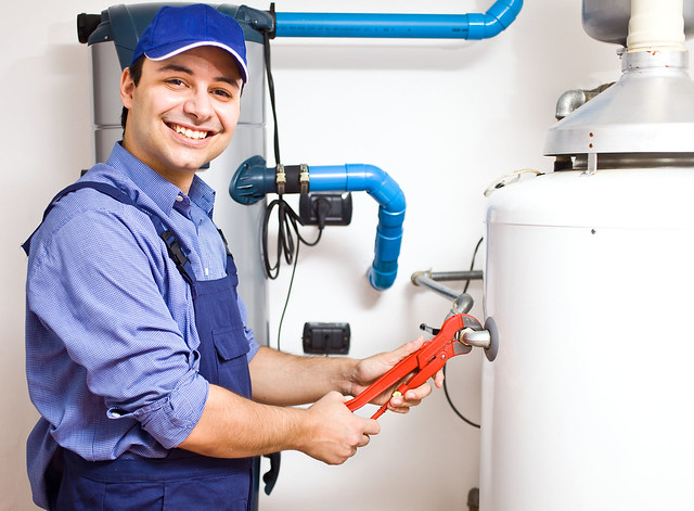 Technician repairing an hot-water heater