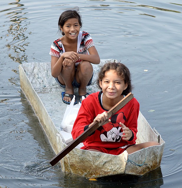 preteen girls in a homemade boat