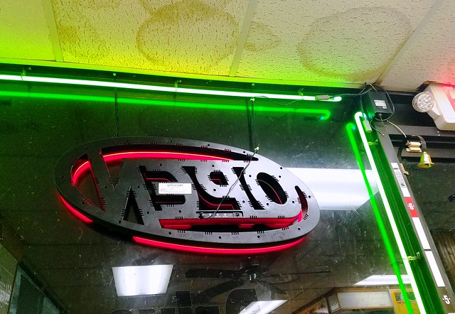 Store front, neon sign & reflection